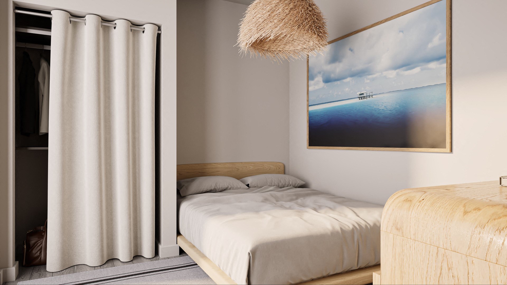a bedroom with a bed and a large picture of the ocean
